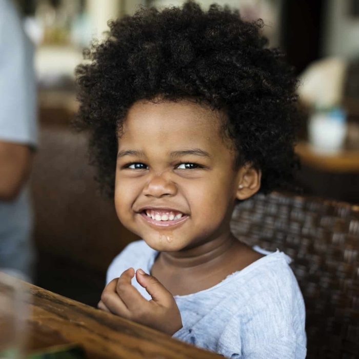 cute-little-african-boy-at-a-resort.jpg